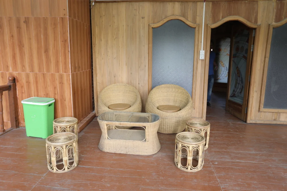 Wicker seating on the covered Aadi Kuthi balcony