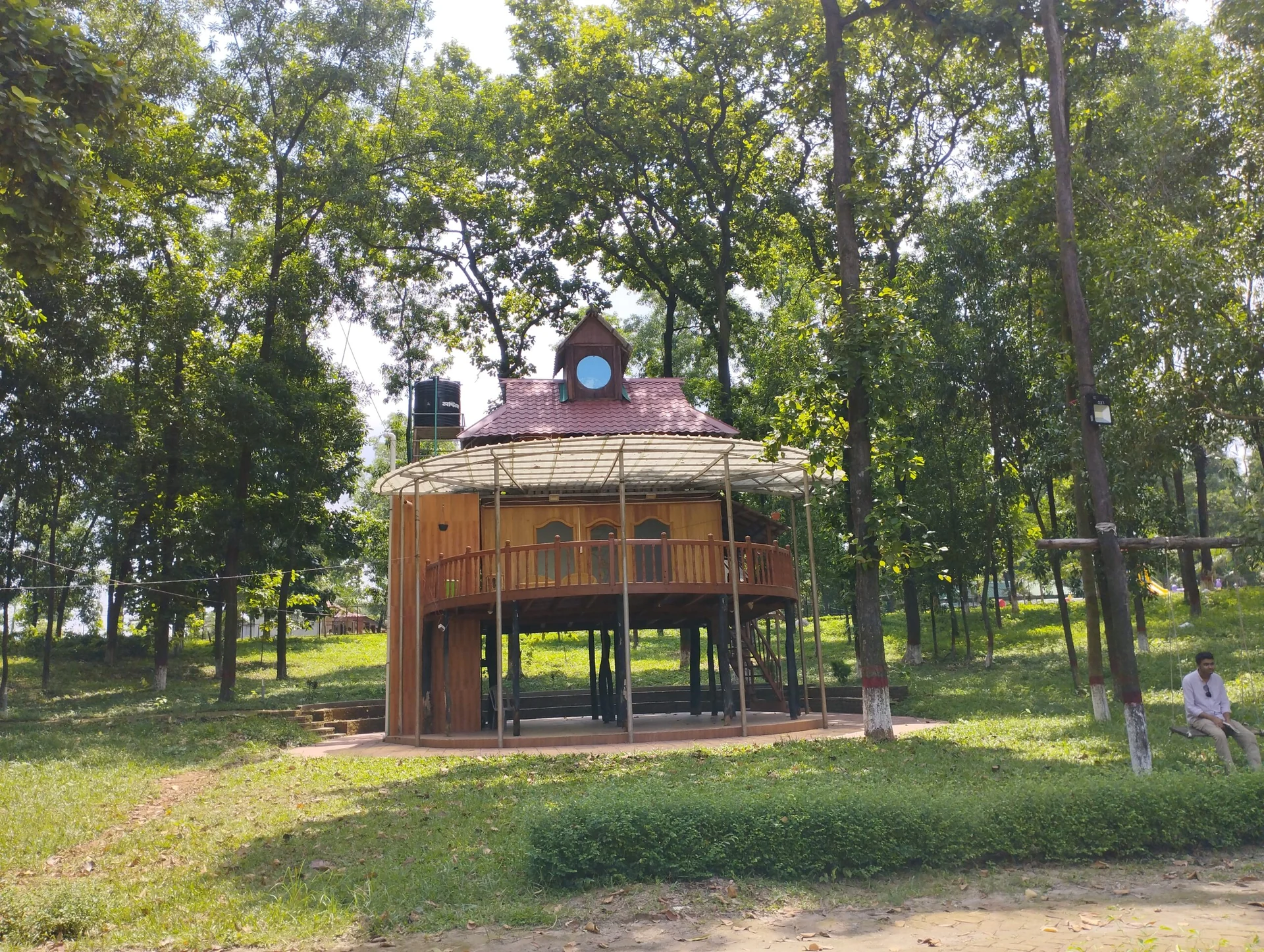Aadi Kuthi wooden cottage among trees