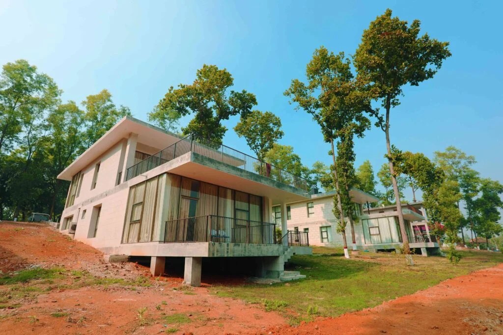 Rajbilash cottage on a wooded hillside